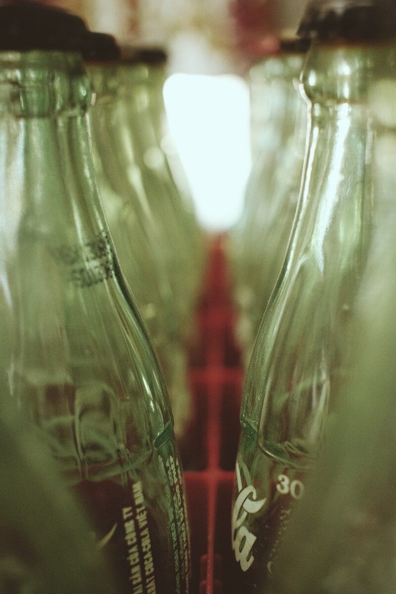 clear glass bottles with red liquid